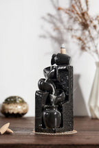 Unique Cascading Basins Ceramic Waterfall Incense Holder, Paired with a Pack of Backflow Incense Cones. (Black)